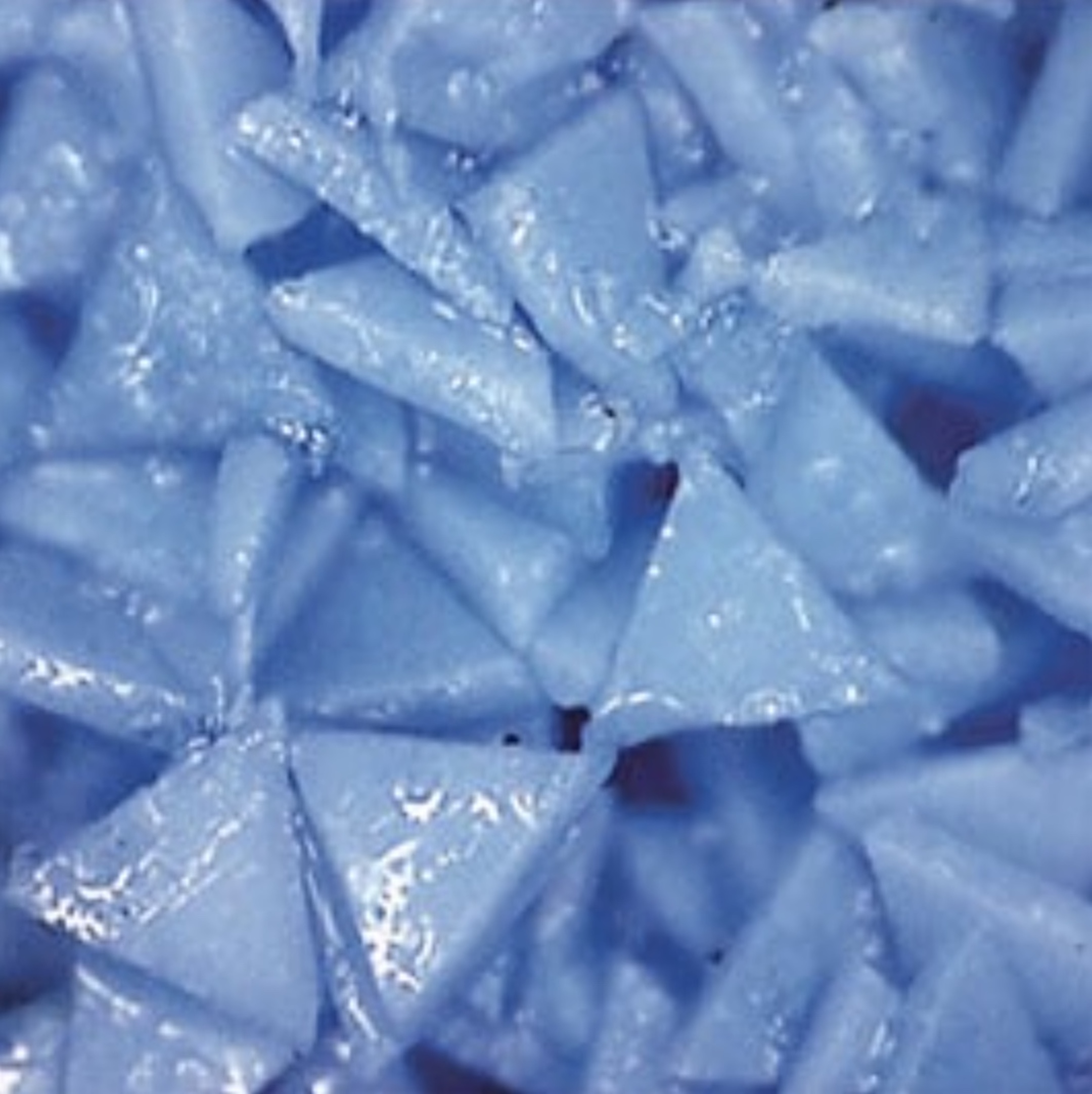 The triangular-shaped ceramic aluminum oxide grains in 3M’s Cubitron II vitrified wheels are said to increase efficiency and productivity in cylindrical grinding operations. (Image courtesy of 3M Abrasives)