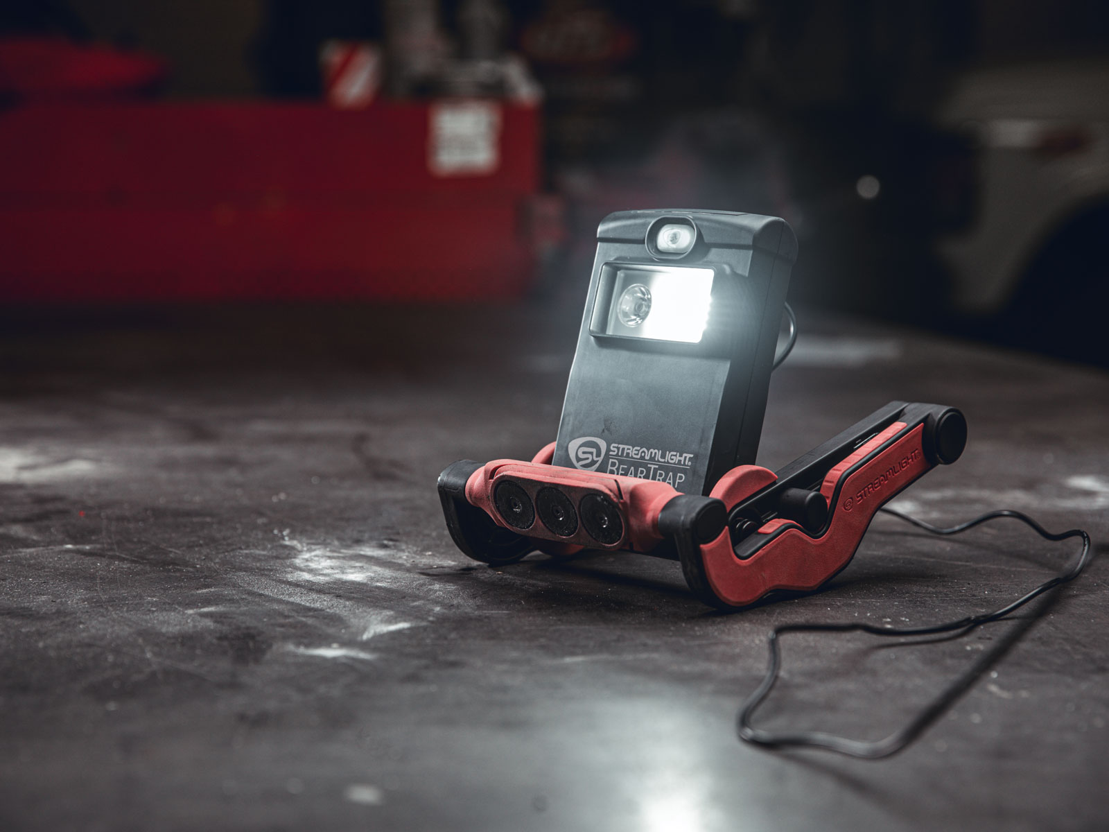 Work lights like this BearTrap rechargeable model can clamp virtually anywhere or stand on their own to light up an environment while keeping the worker’s hands free. (Photo courtesy of Streamlight)