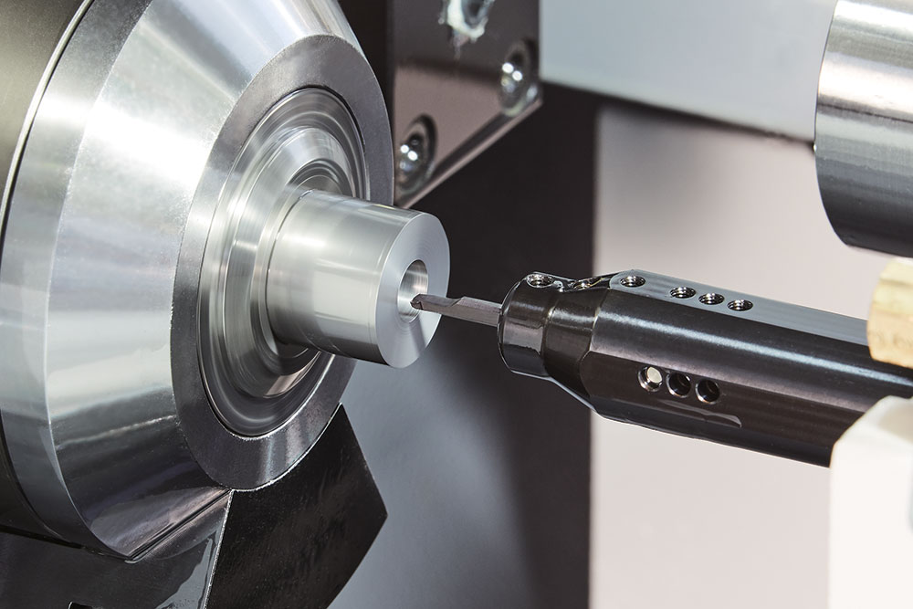 The EZ-Bar, right, holding an insert. The system for small-diameter machining counters common problems that can impede machine shop automation efforts. | Image courtesy of Kyocera