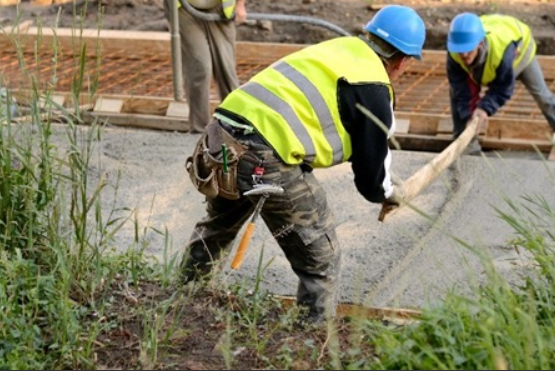 Construction workers at all types of construction sites should wear safety vests. Many sites contain moving equipment and vehicles, and visibility is key to safety.


