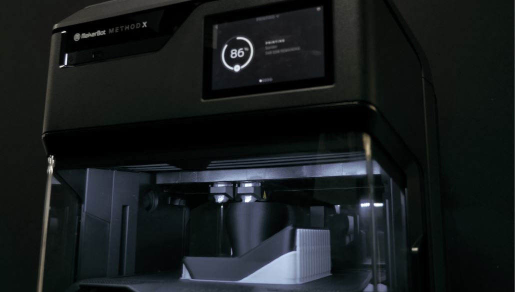 The MakerBot METHOD uses dual extruders to print dissolvable support material underneath the model.
