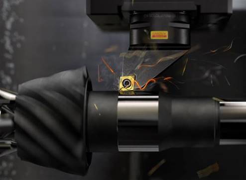 A Sandvik insert is shown being used to machine a workpiece.